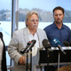 John Ruszczyk, second left, is supported by his wife Maryan Heffernan, left, his son Jason Ruszczyk and his wife Katarina, right, as he makes a statement in Sydney, Thursday, Dec. 21, 2017, demanded a more rigorous probe into the fatal shooting of his daughter, Justine Ruszczyk Damond, by Minneapolis police. John Ruszczyk said his family was deeply concerned about the possibility “the initial investigation was not done properly, and with the greatest integrity or sense of completeness.”